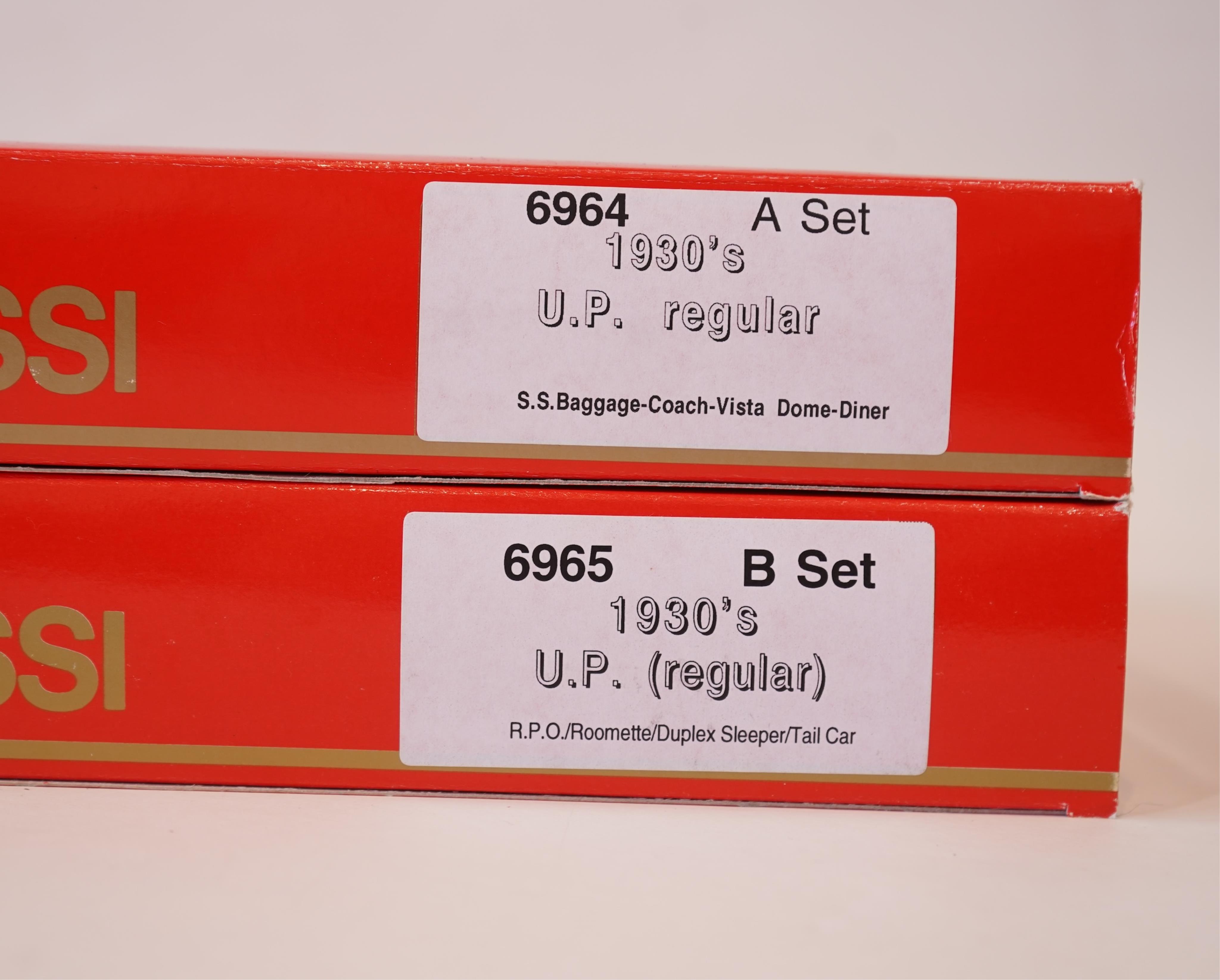 Two boxed Rivarossi 1930s Union Pacific coach packs; A Set (6964) and B Set (6965), both containing four coaches, together with three individually boxed coaches (2654, 2689 and 2814), plus four bogie freight wagons (2255